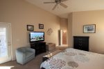 Master suite offers a flat screen TV and patio access
